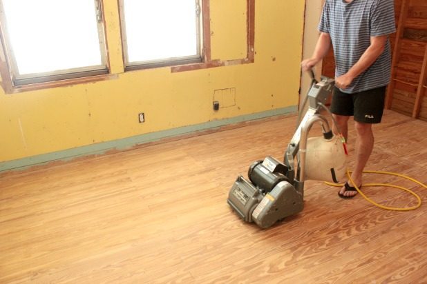 How To Restore Wood Flooring In 4 Easy Steps? sanding-the-floor